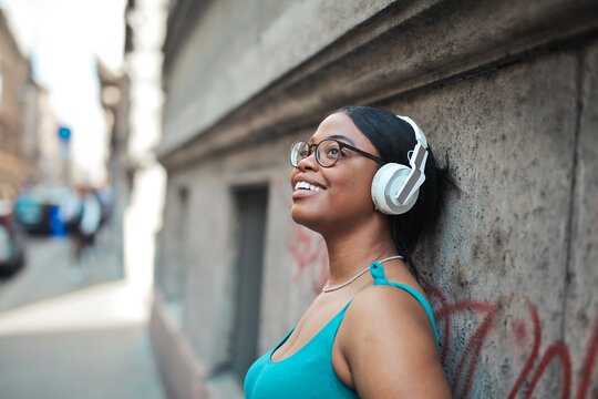 portrait of young woman while listening to music