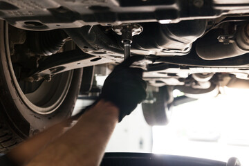 Car on a lift. Car service. HUNDRED.
