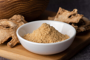 Dry ginger in a bowl. Dry ginger powder. Ginger dry pieces.