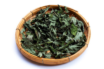 Dried mugwort leaves on white.