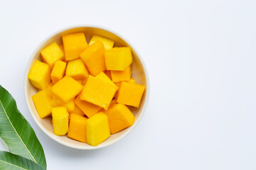 Tropical fruit, Mango in white bowl on white background. Top view