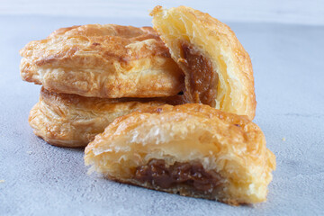 Puff pastry of arequipe, displayed on gray background