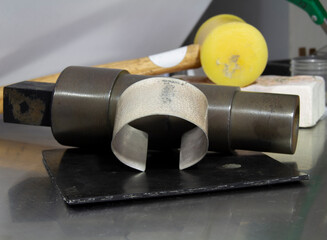 Sterling Silver Hammered Cuff Bracelet in Raw Pre- Polish Stage in Process on Jeweler's Bench with...