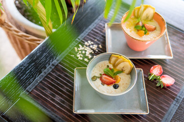 Healthy breakfast in a bowl with homemade baked granola, fresh s