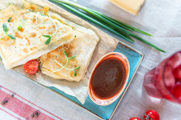Lavash with cheese, ketchup and greens