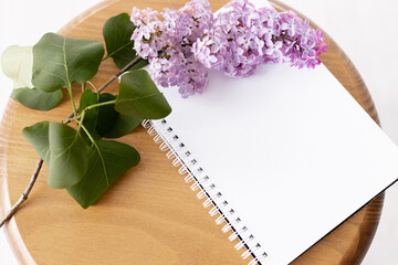 planner mockup with lilac. morning, craft envelope, blossom, flat lay, top view, notebook, lily pf the valley