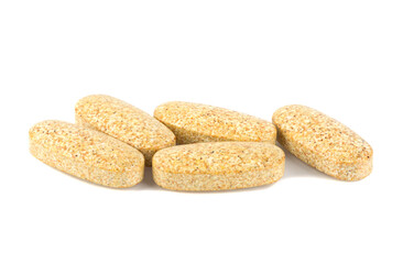 Rhodiola rosea. Golden root, rose root. Herbal pills with healthy medical plant. Healthy supplement on white background.