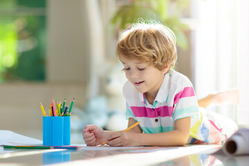 Child drawing. Kid painting rainbow.