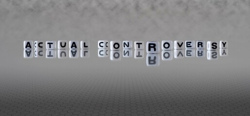 actual controversy word or concept represented by black and white letter cubes on a grey horizon...