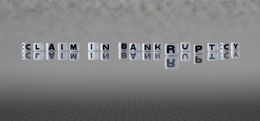 claim in bankruptcy word or concept represented by black and white letter cubes on a grey horizon...
