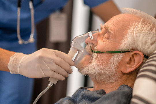 Healthcare professional preparing the patient for an oxygenation procedure
