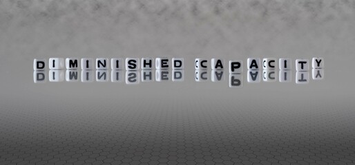 diminished capacity word or concept represented by black and white letter cubes on a grey horizon background stretching to infinity