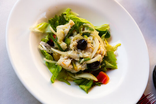 Esqueixada cod, salad of shredded salt cod with vegetables, typical dish of Catalan cuisine