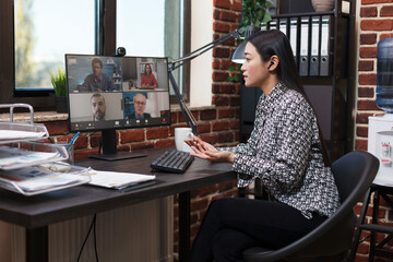 Business woman on virtual conference videocall communicating marketing strategy to company...