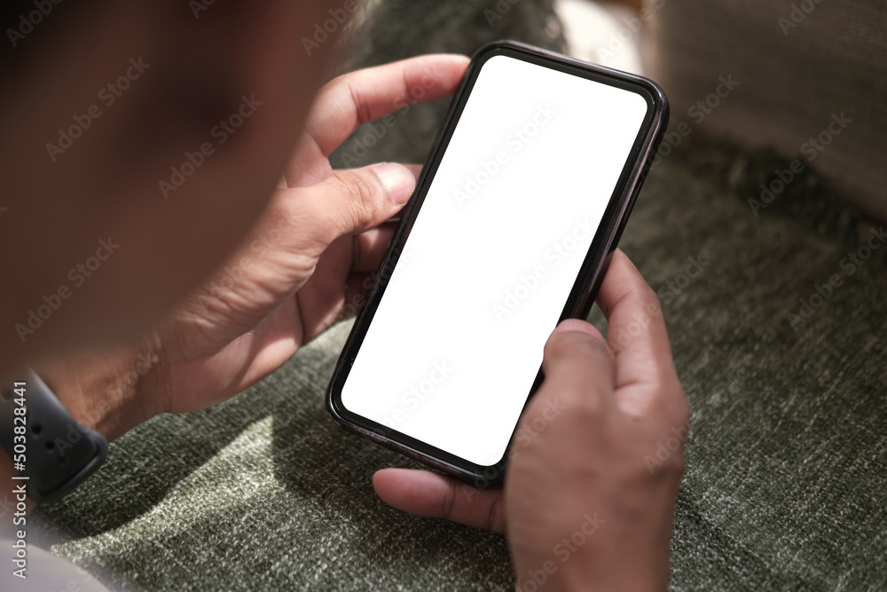 Poster close up view man holding smart phone with empty screen for your text message or information content