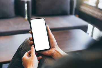 cell phone blank white screen mockup.hand holding texting using mobile on desk at office.background empty space for advertise.work people contact marketing business,technology
