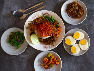 Tanjung Balai Rice Coconut Milk, topped with fish, vegetables and shellfish, at Medan, North Sumatera