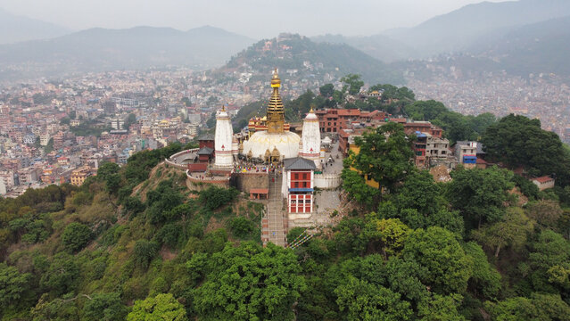 Bird's eye view of the Swayambhu religious complex in bright sunlight in Kathmandu, Nepal