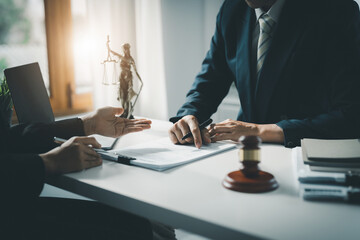 Law, Consultation, Agreement, Contract, Attorney or Lawyer holding a pen is consulting with a client to explain the pattern of answering questions before going to court to decide a lawsuit.