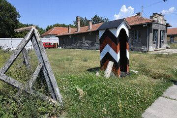 Closeup of a striped guardhouse outdoors on a sunny day - obrazy, fototapety, plakaty