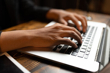 professional business person typing on computer laptop desk at office, using keyboard technology for working on online workplace communication job