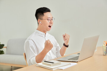 A moment of young working with laptop at home in living room background 