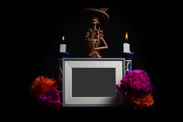 Photo frame with death decorations isolated on a black background