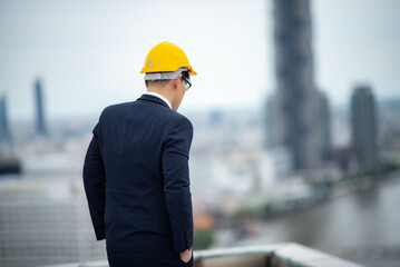 male adult engineer or professional businessman standing for concept of business industry and construction technology, factory architect manager thinking a work with job for project success