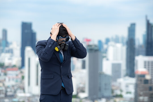 portrait of businessman wearing gas pollution protection face mask and suit, concept of danger toxic safety for human and chemical environment problem man about hazard business