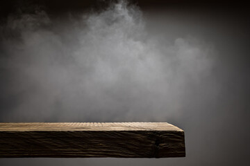 Wood plank podium with smoke in the dark