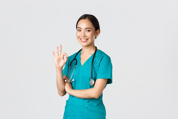 Covid-19, healthcare workers, pandemic concept. Confident professional asian doctor, female...