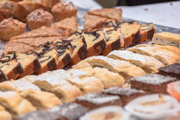 Traditional cakes and sweets during a celebration in Val Isarco, Dolomites