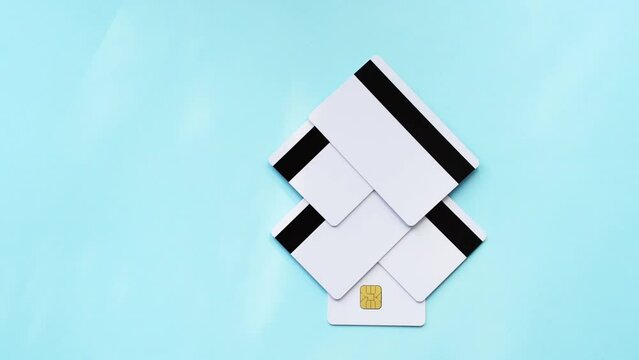 Plastic credit card mockup and chip. HD video. Color blue background. Atm empty debit payment. Currency shopping with stripe. Christmas tree shape