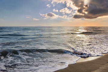 Fototapeta na wymiar beautiful seaside landscape at dawn under cloudy sky