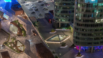 Obraz na płótnie Canvas New promenade on gate avenue located in Dubai international financial center aerial night timelapse.
