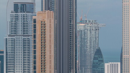 Panoramic skyline of Dubai with business bay and downtown district timelapse.