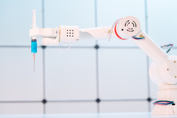 Robot hand with a medical syringe. Future medicine concept using robots and artificial intelligence