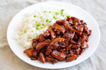 Homemade Teriyaki Chicken with White Rice on A Plate, side view.