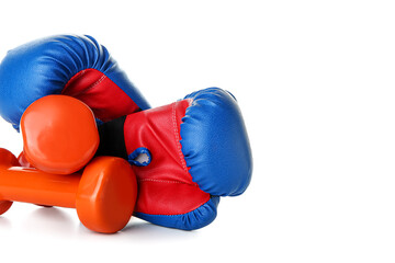 Boxing gloves with dumbbells on white background
