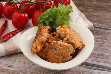 Fried salmonn cutlet in the bowl