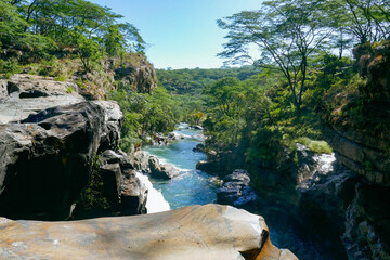 Fototapeta na wymiar Scenic view of Nyaugenge Waterfalls in Mpanga Kipengele National Reserve