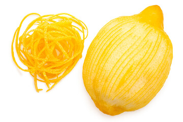 Half of peeled lemon next to heap of lemon zest from above.