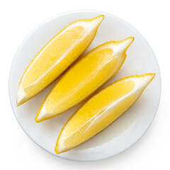 Three segments of fresh lemon on white plate from above.