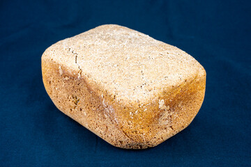The freshly baked bread on a black background close-up. Making bread.