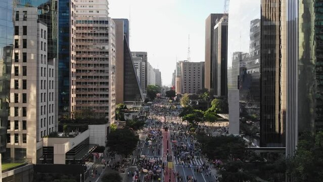 Aerial View Of A Large City Main Street Filled With Many Walking People On Weekend (Sao Paulo, Brazil)