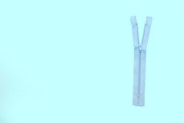 Stylish zipper on blue background