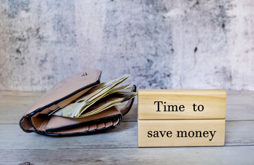 Pink lady wallet with money and message  time to save money 