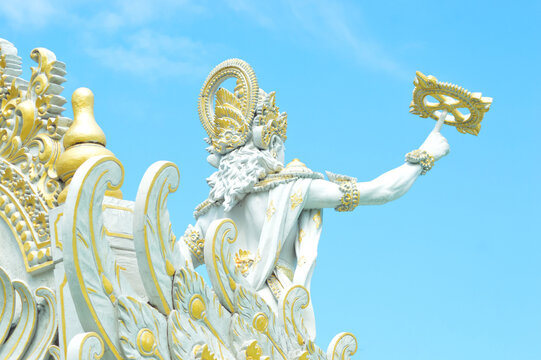 Low Angle Back View Krishna Chakra Statue On Blue Sky In The Park