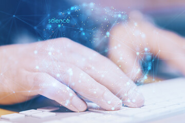 Fototapeta premium Close up of hands using keyboard on office desktop with creative digital linear sphere on blurry background. Global network and communication concept. Double exposure.