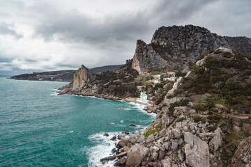 Fototapeta na wymiar Coastal seascape landscape with Mount Cat or Koshka from rock Diva on cloudy weather. Simeiz, Crimea